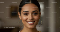 Beautiful smiling woman with earrings in a professional portrait