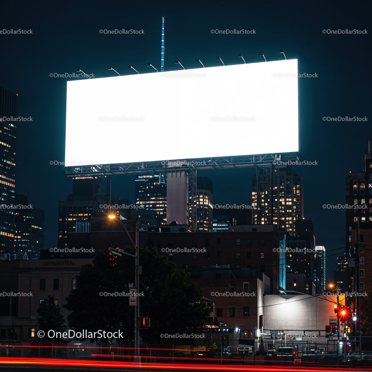 Empty illuminated billboard over cityscape at night