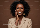 Elegant African American Woman with Curly Hair in Beige Blazer