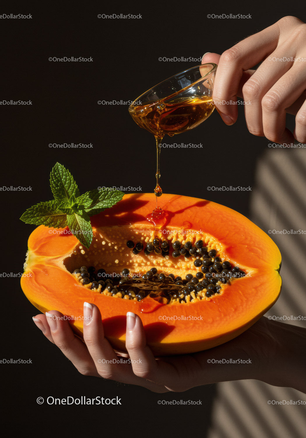 Honey Drizzling onto Fresh Papaya with Mint Leaves
