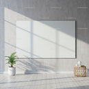Minimalist room with blank white canvas and indoor plant
