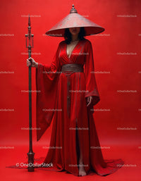 Elegant Woman in Red Dress with Accessories Against Red Background