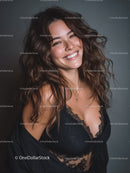 Joyful Woman with Wavy Hair in Black Lace Dress