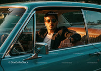 Stylish Man Driving Vintage Car in Outdoor Sunset Scene