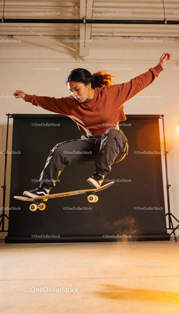 Skateboarder Performing an Ollie Trick in Studio