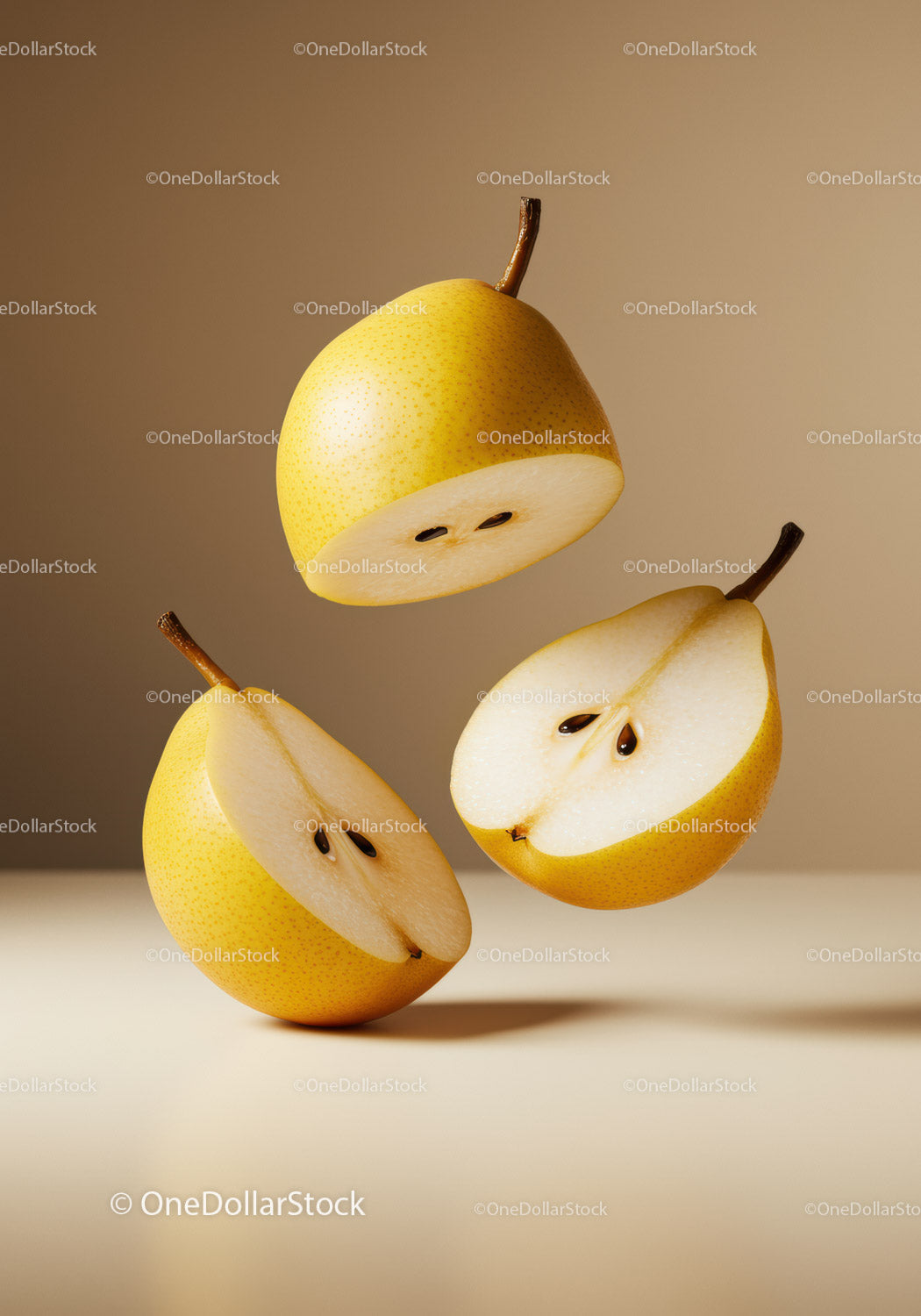 Floating fresh yellow pears cut in half on beige background