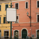 Empty street sign with colorful Italian building background