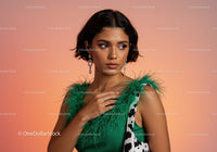 Fashion Portrait of a Young Woman Wearing a Green Feathered Top