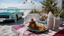 Tasty Cheeseburger with Fries and Milkshake on Beachside Picnic Table
