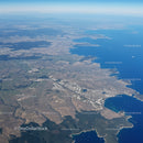 Aerial View of Lake Shoreline with Coastal Landscape and Urban Area