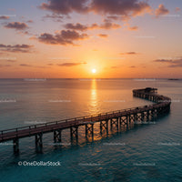 Beautiful Sunset Over Pier Extending Into Calm Ocean