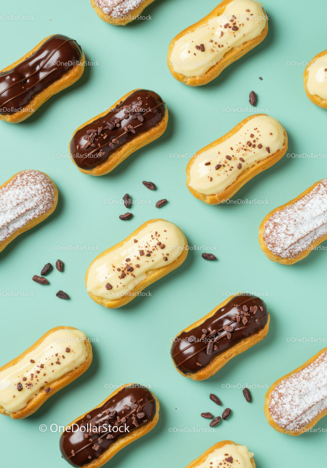Delicious chocolate and vanilla éclairs on turquoise background