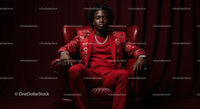 Confident Man in a Bold Red Suit Sitting Elegantly