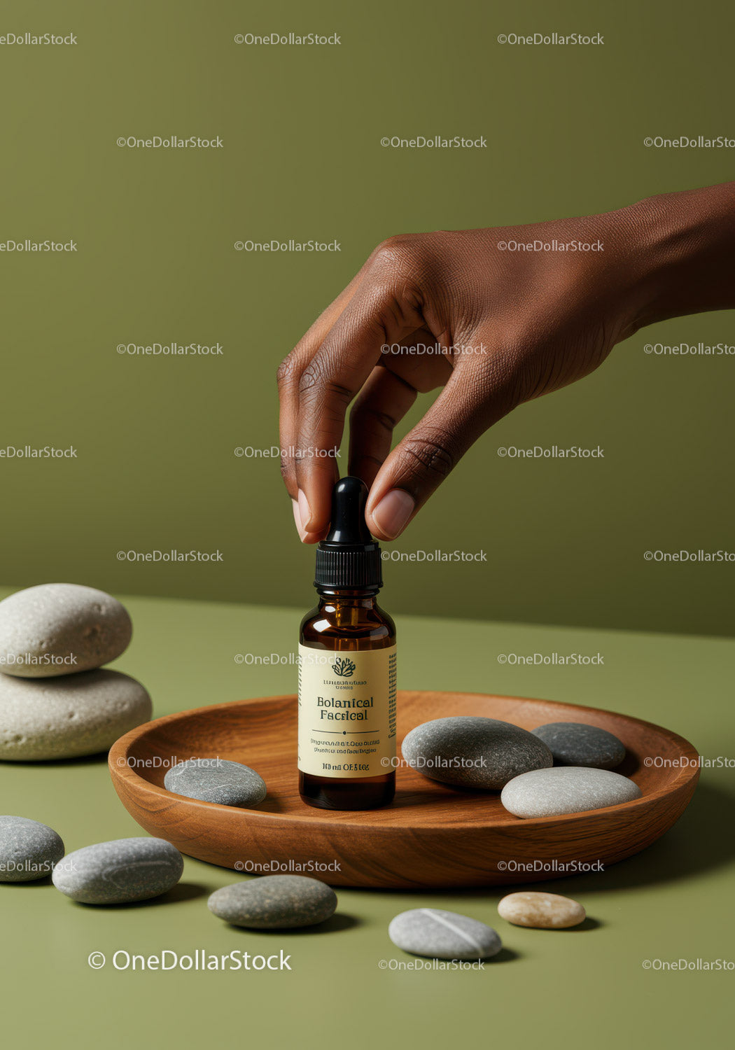 Botaniczne serum do twarzy w butelce z kroplomierzem i gładkimi kamyczkami