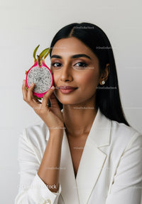Elegant Woman with Slice of Dragon Fruit for Healthy Lifestyle Concept