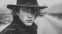 Male Model in Black Coat with Wet Hair in Rainy Outdoor Setting