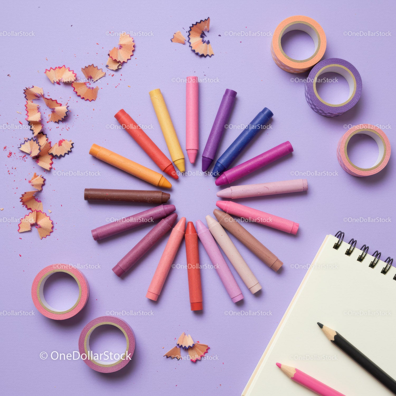 Colorful Crayons Arranged in Circle on Purple Background
