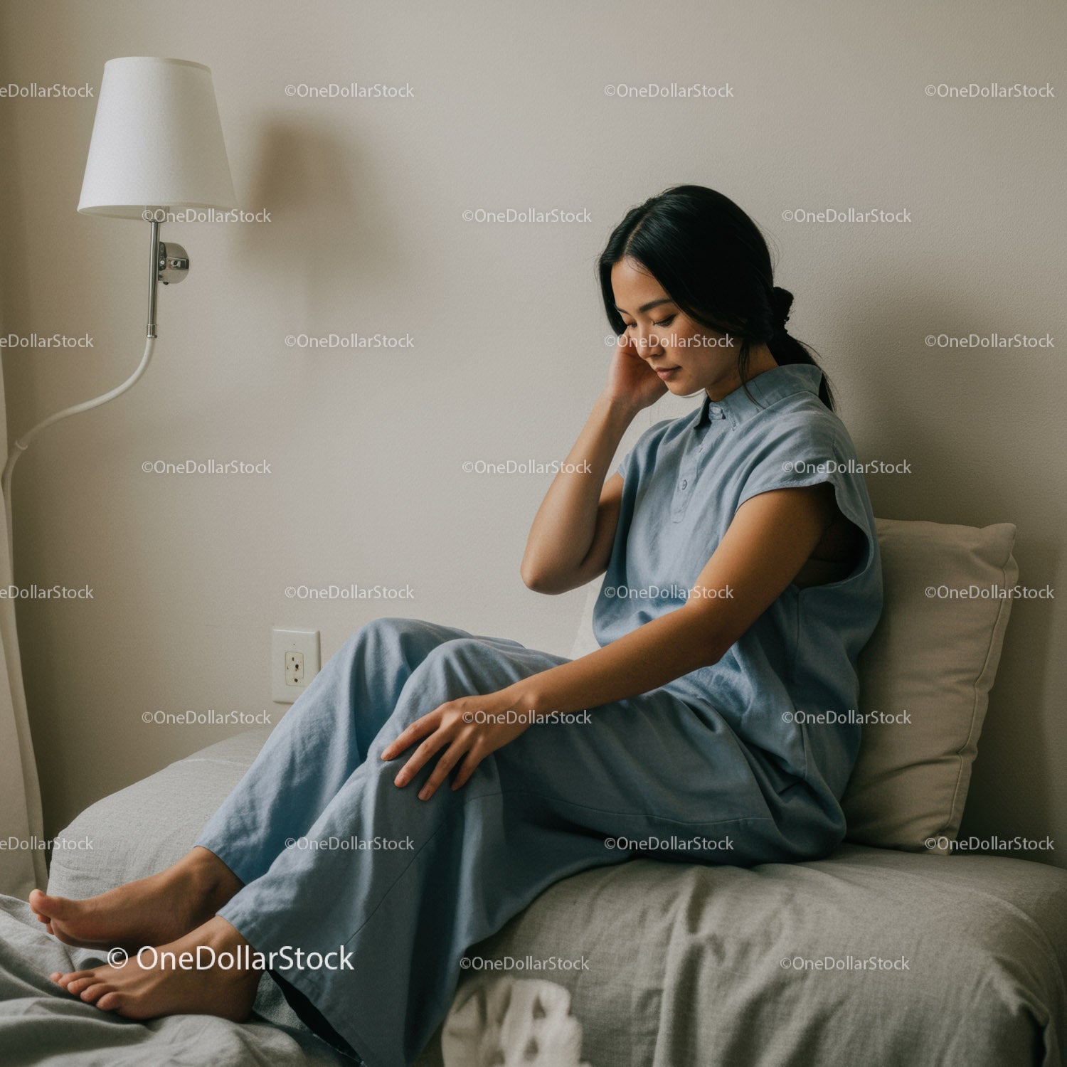 Relaxed Woman Sitting on Bed in Hospital Room for Wellness and Rest