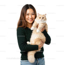 Smiling woman holding large fluffy cream cat