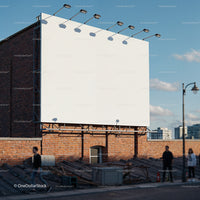 Empty urban billboard mounted on brick wall