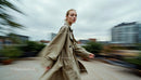 Dynamic Urban Fashion Scene with Confident Woman in Motion