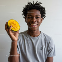 Young Man Holding Fresh Mango with Bright Smile, Casual Clothing