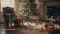 Cozy Christmas Corner with Decorated Tree and Fireplace