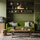 Cozy living room with green sofa and rustic decor