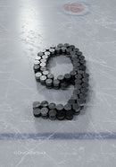 Hockey pucks arranged as number nine on ice rink