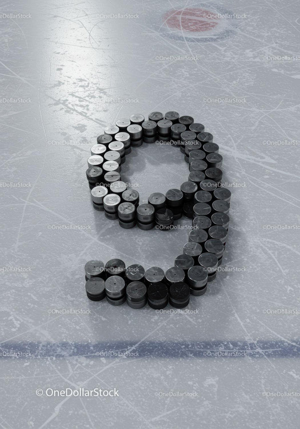 Hockey pucks arranged as number nine on ice rink