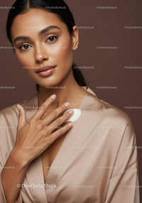 Beautiful Woman with Glowing Skin Applying Moisturizer for Natural Beauty