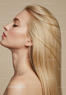 Closeup profile of serene blonde woman with flowing hair