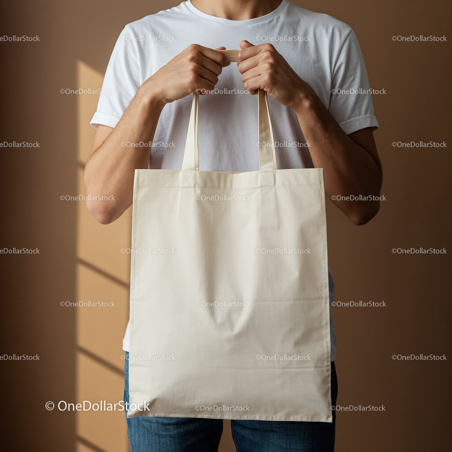 Man Holding Blank Canvas Tote Bag in Casual Outfit