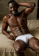 Smiling muscular man relaxing on bed in white underwear