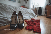Chic Black Heels and a Red Lace Dress in a Cozy Bedroom Setting