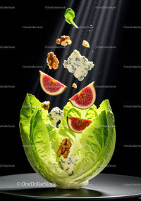 Fresh fig and blue cheese salad with walnuts in lettuce