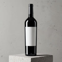 Classic Red Wine Bottle with Blank Label on Concrete Pedestal