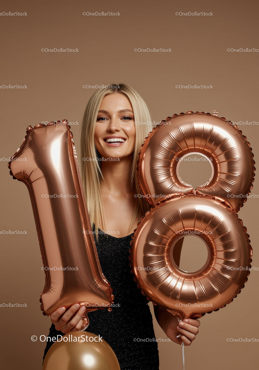 Smiling Young Woman Holding 18th Birthday Balloons
