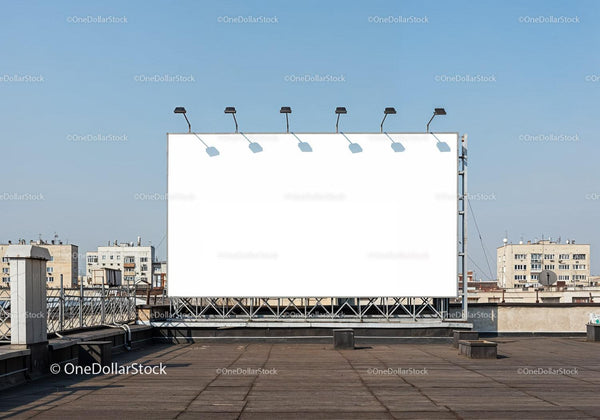 Empty billboard on urban rooftop under clear sky JPG Mockup Image