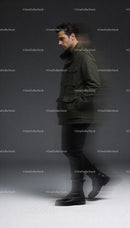 Man in green jacket and black boots walking