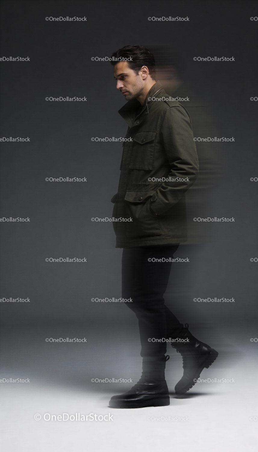 Man in green jacket and black boots walking