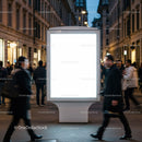 Blank illuminated billboard on busy city street at dusk