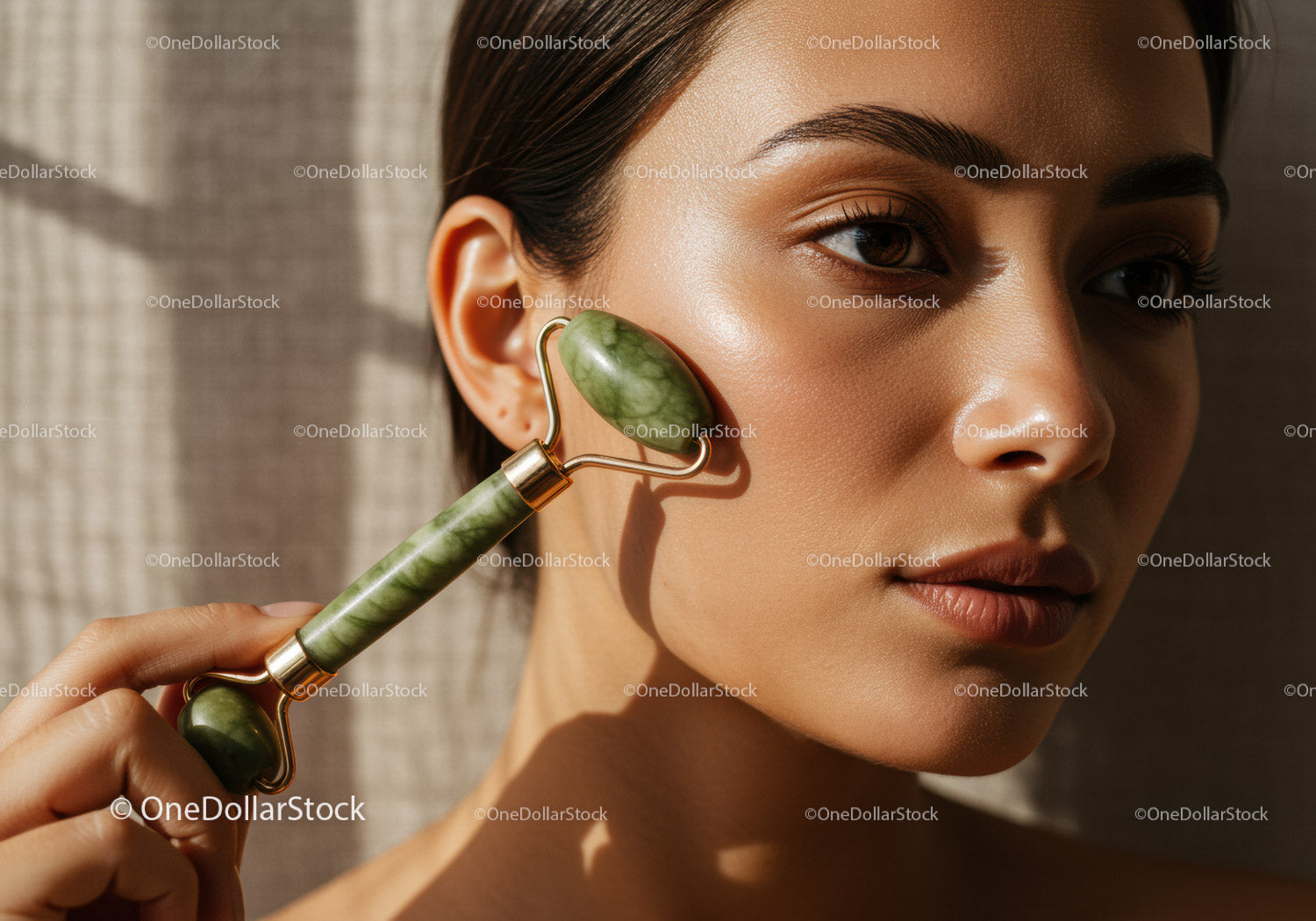 Close Up of Woman Using Jade Roller for Facial Massage