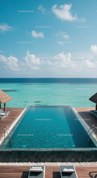 Luxury Infinity Pool Overlooking Calm Ocean with Wooden Deck and Loungers