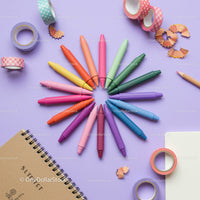 Colorful crayons arranged in a creative circle on desk