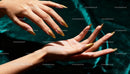 Golden Metallic Nail Art on Elegant Female Hands