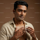 Close-up of a Man Applying Lotion to Face and Neck With Focus on Skin Care