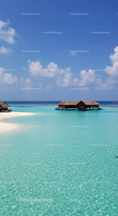 Idyllic Overwater Bungalows with Turquoise Lagoon and Clear Sky
