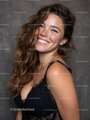 Smiling Woman with Long Wavy Hair Wearing Black Lace Dress