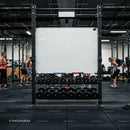 Modern gym with dumbbells and active people training